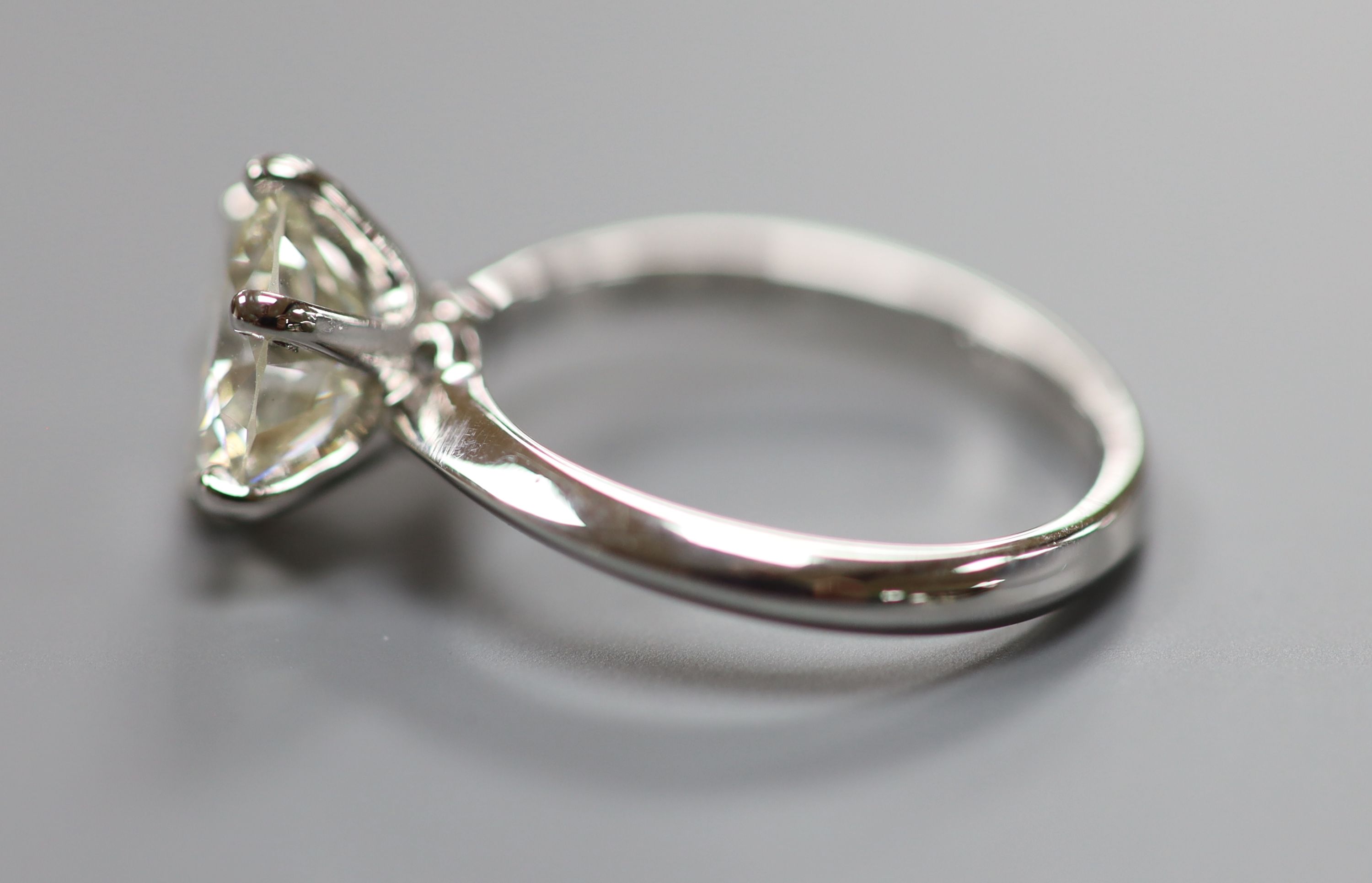 A modern platinum and solitaire diamond ring,